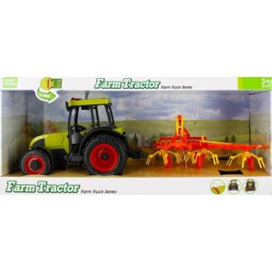 Traktor se zemědělským strojem s osvětlením